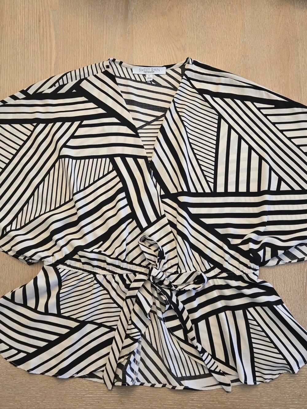 Flowy Black and Cream Geometric Tie-Waist Asymmetrical Blouse